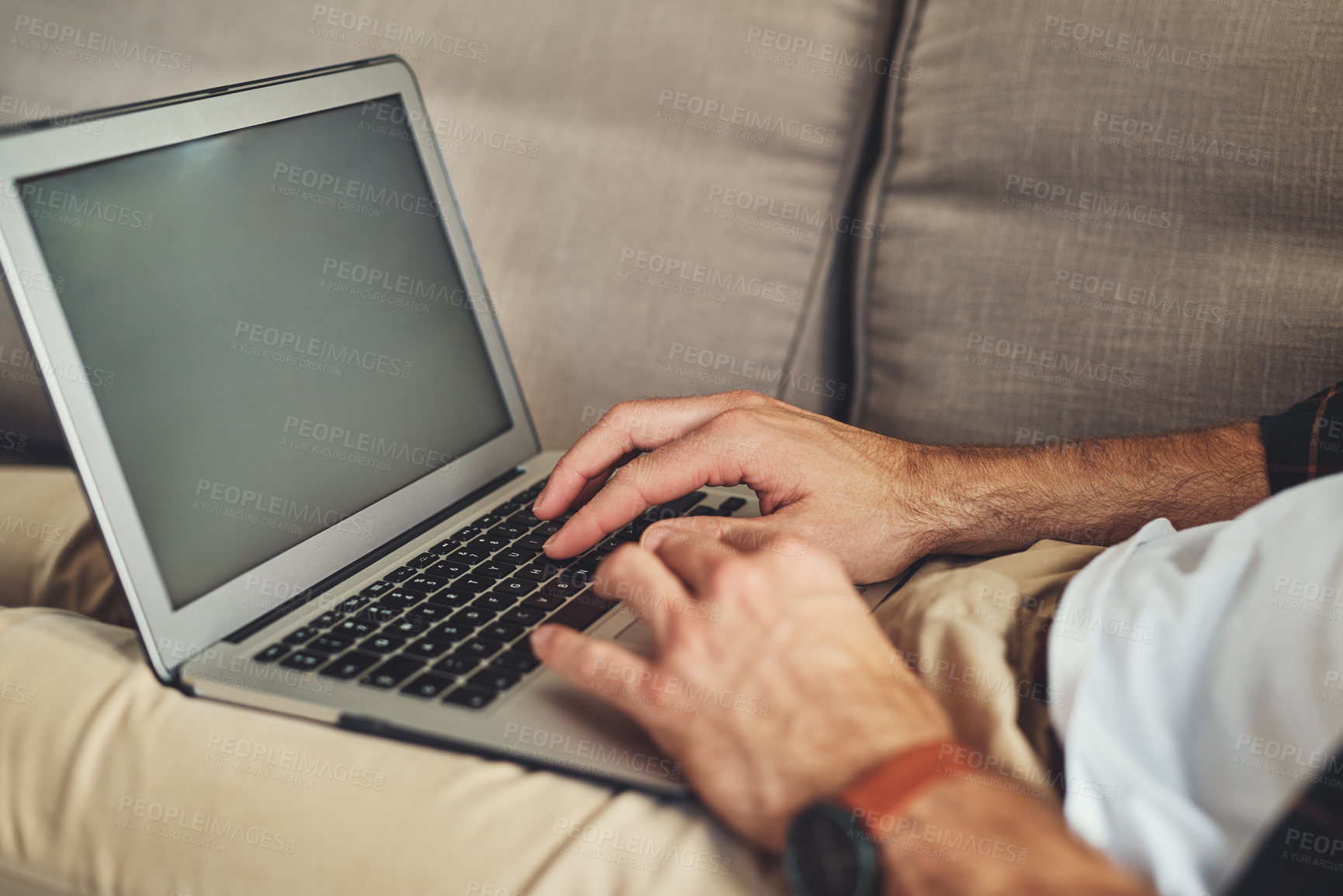 Buy stock photo Hands, laptop screen and person typing in home for remote work, reading email and mockup space. Computer, relax and freelance copywriter in living room for writing article, research  and news on sofa