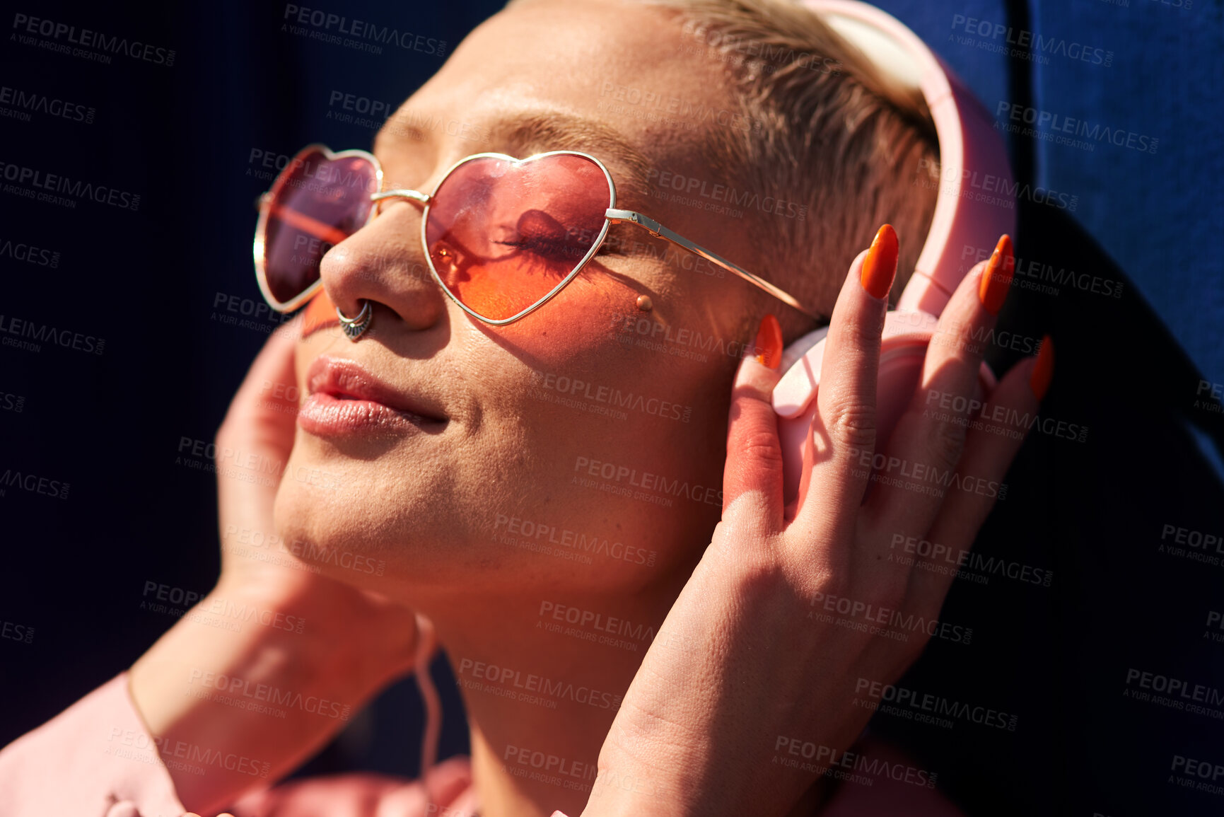 Buy stock photo Music, headphones and happy for podcast in the sun, heart glasses and radio with peace. Streaming, smile and female from Brazil listening to song, sound in urban town and girl playing in playlist