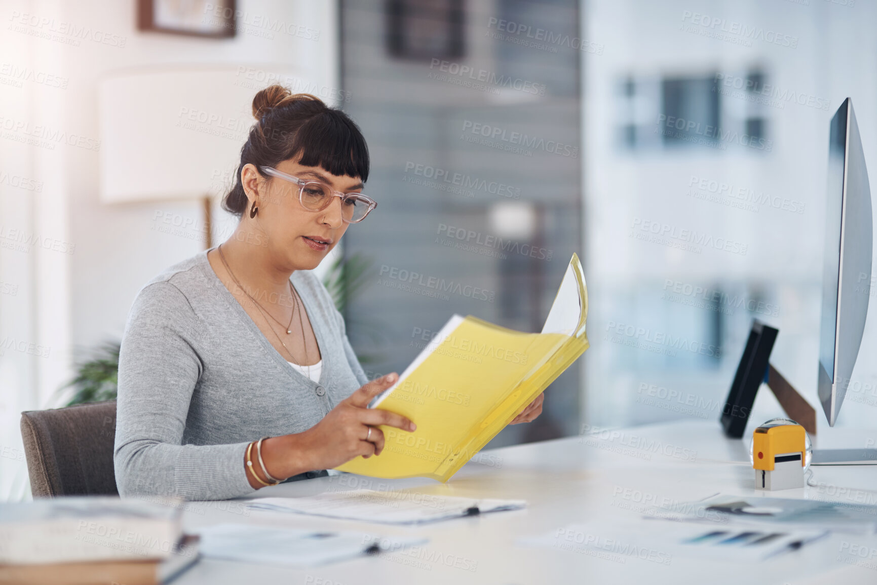 Buy stock photo Woman, reading and folder for documents at modern office with decision, review or contract at startup. Person, small business and paperwork for check, feedback or proposal for deal at creative agency