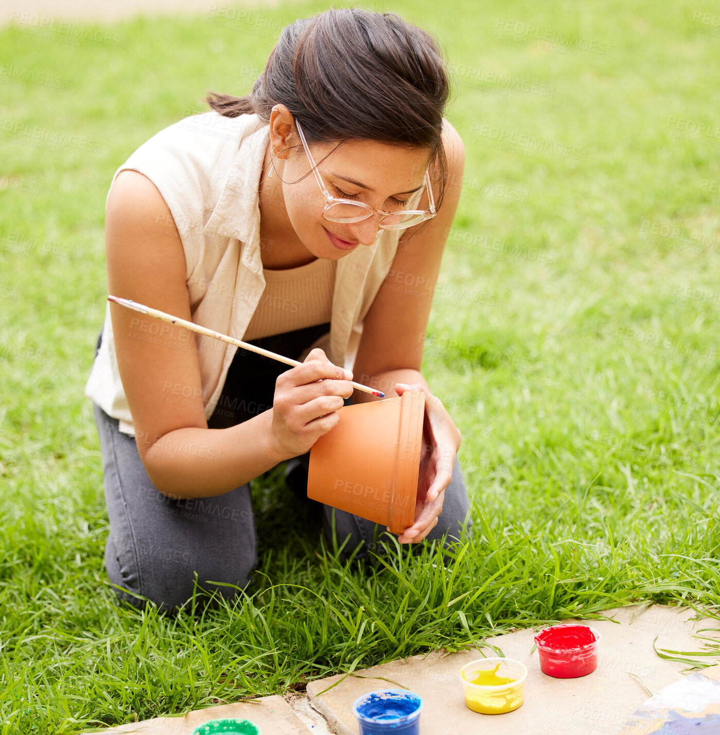 Buy stock photo Ceramic, painting and girl with pot craft or container for plant in garden with creativity for hobby. Clay, art and artist with inspiration outdoor with paint brush, decoration or fun project