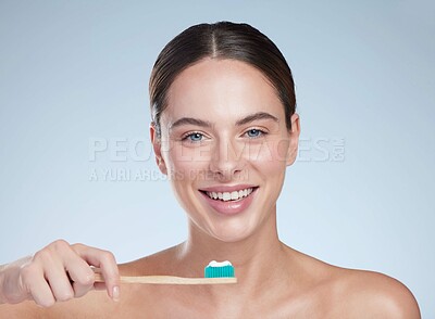 Buy stock photo Portrait, beauty and woman in studio with toothbrush, hygiene and dental care on white background. Toothpaste, product and smile for influencer and brand deal, medical and promotion for female person