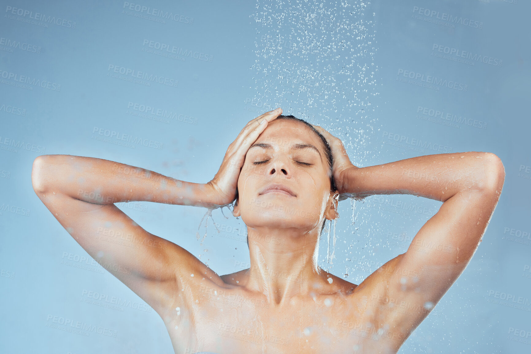 Buy stock photo Girl, shower and calm in studio for hygiene with organic, eco friendly cosmetic and daily routine. Woman, isolated and blue background with self care, water and peace with eyes closed for freshness