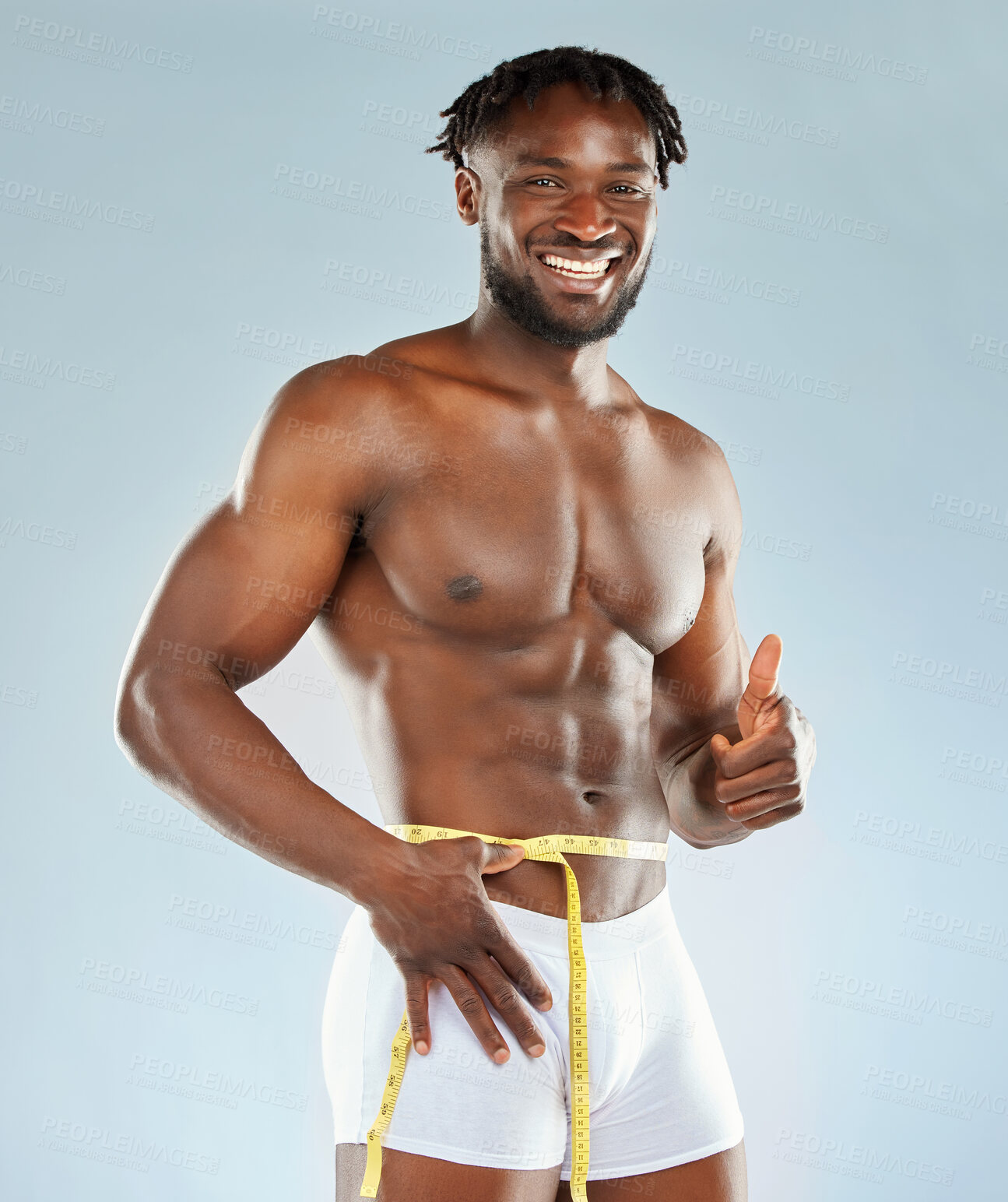 Buy stock photo Weight loss, thumbs up and portrait of black man for fitness, workout and diet success in studio. Transformation, progress or results for exercise with tape and bodybuilder by white background 