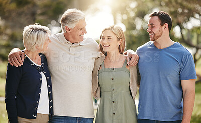 Buy stock photo Happy, nature and people with senior parents at outdoor park with connection on family holiday. Smile, hugging and adult siblings with elderly mother and father in field on vacation in California.
