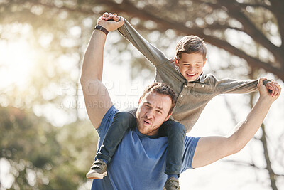 Buy stock photo Shoulders, park and dad with kid for playing for fun, bonding and playful relationship. Family, nature and happy father carry young boy for adventure outdoors for care, love and support on weekend