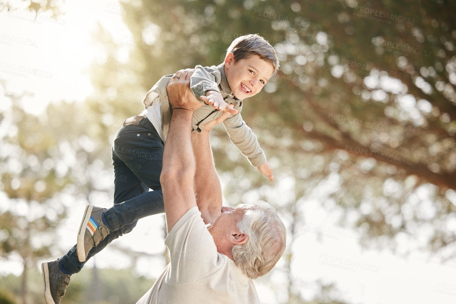 Buy stock photo Flying, park and grandpa with child for playing for fun, bonding and playful relationship. Family, nature and happy grandfather lift boy for adventure outdoors for care, love and support on weekend