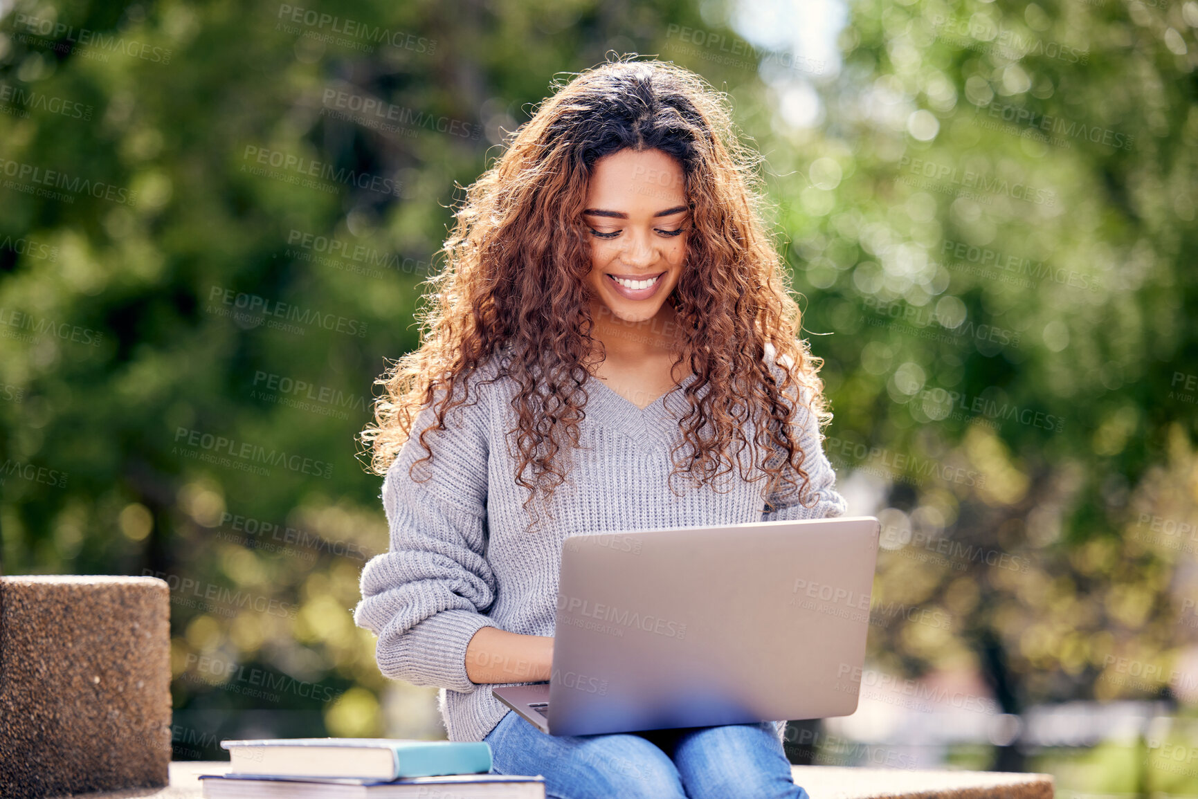 Buy stock photo Student, laptop and woman with books at park outdoor for education, research or studying. Happy African female on university or college campus in nature with tech for knowledge, internet or learning