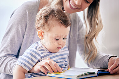 Buy stock photo Mother, baby and reading book for story in home, literacy and learning abc for language development. Mama, son and parent for fairytale or together for storytelling at table, love and kid for bonding