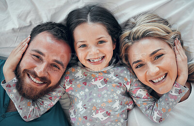 Buy stock photo Top view, happy and portrait of family in bedroom with smile, for love and relax together in home. Mom, dad or support for kid and excited for new house, wellness and care in morning or apartment