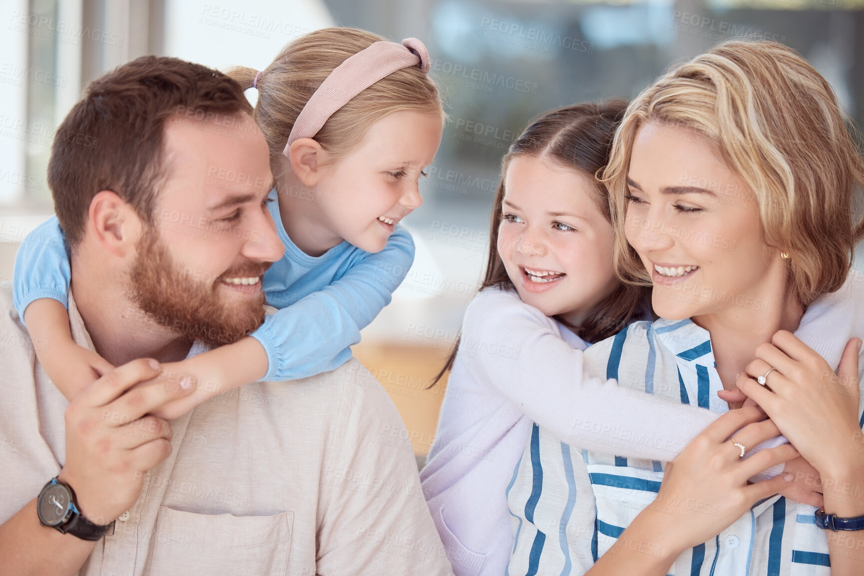 Buy stock photo Parents, kids and smile in home for hug, support and trust in living room. Happy family, children and relax in embrace for emotional connection, weekend fun and affection with love and security