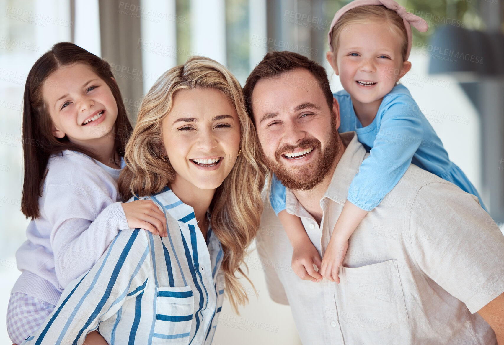 Buy stock photo Parents, kids and piggy back in home for portrait, smile and bonding with care in family house. Father, mother and daughter siblings with love, happy and connection with games at apartment in Italy