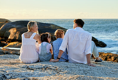 Buy stock photo Family, relax and outdoor back on beach, holiday and support children in nature. Parents, son and daughter for fun or love for happiness, weekend trip and travel together on sea or ocean vacation