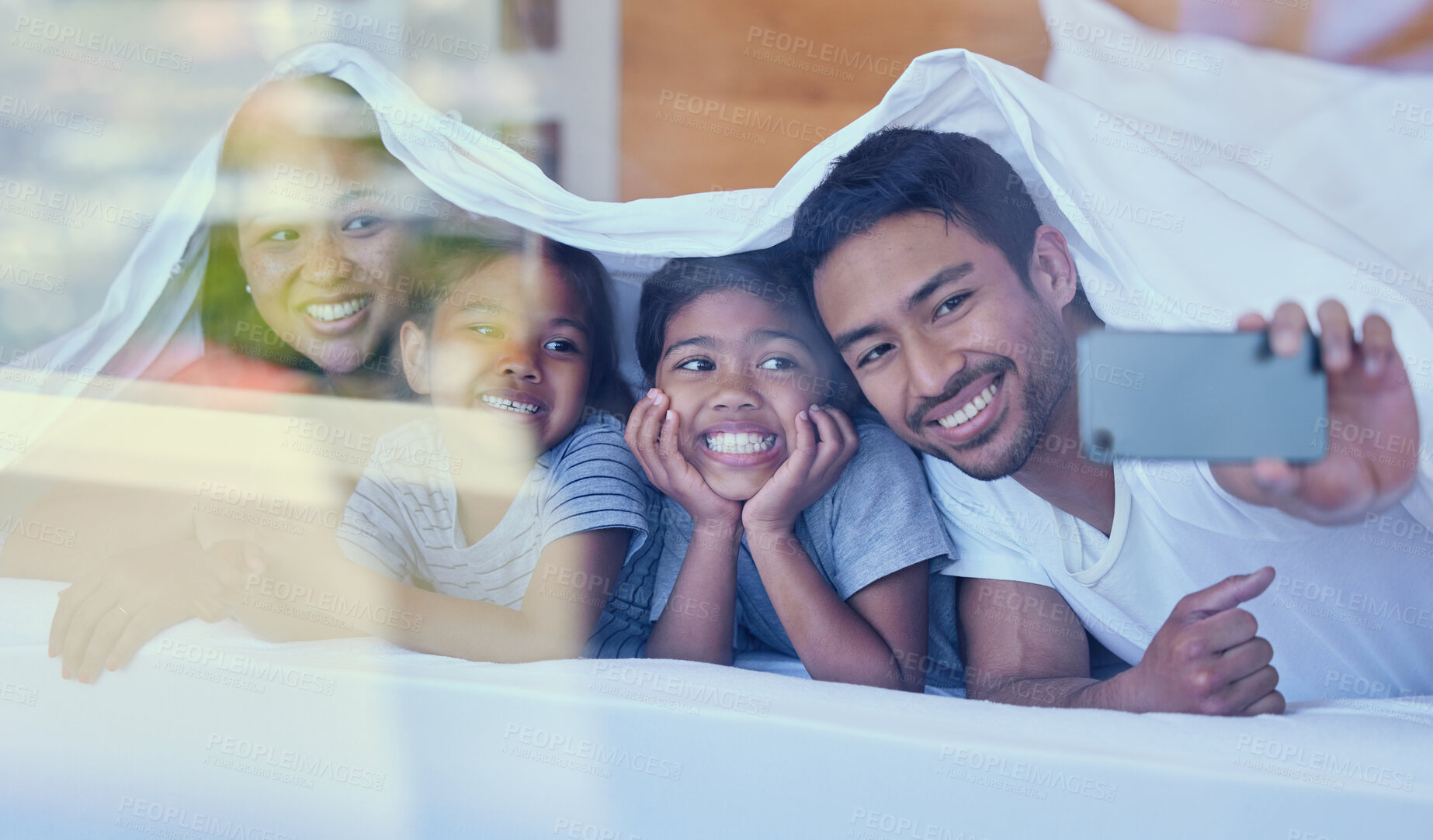 Buy stock photo Family, selfie and blanket with smile on bed for relax, bonding and break on weekend together. Woman, father and child in home with love, care and support for comfort or happiness in Philippines