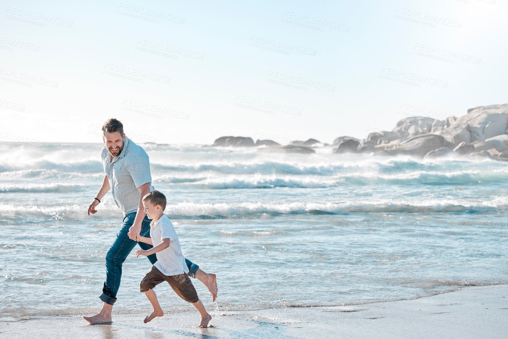 Buy stock photo Beach, dad and kid holding hands on walk for holiday adventure together on tropical island with waves. Nature, father and boy child on ocean vacation with travel, fun and happy bonding in Australia