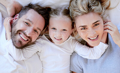 Buy stock photo Bed, above and portrait of parents with child for relax, resting and comfortable in morning. Happy family, home and mother, father and girl in blanket for bonding, relationship and love on weekend