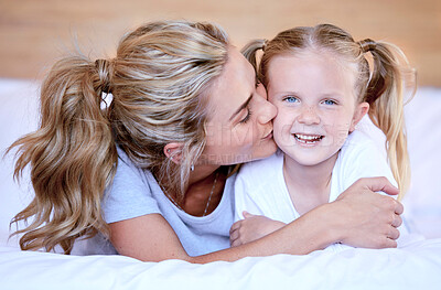 Buy stock photo Kiss, mother and girl in bed for smile, rest and bonding in bedroom of family home. Happy, parent and mom person with affection and young child for unity, support and love or cozy together on weekend