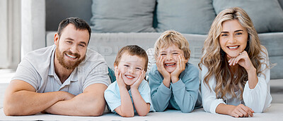 Buy stock photo Relax, parents and portrait of children on floor, connection and relationship with bonding at home. Happy people, mother and father with kids on carpet, security or family together with love in house