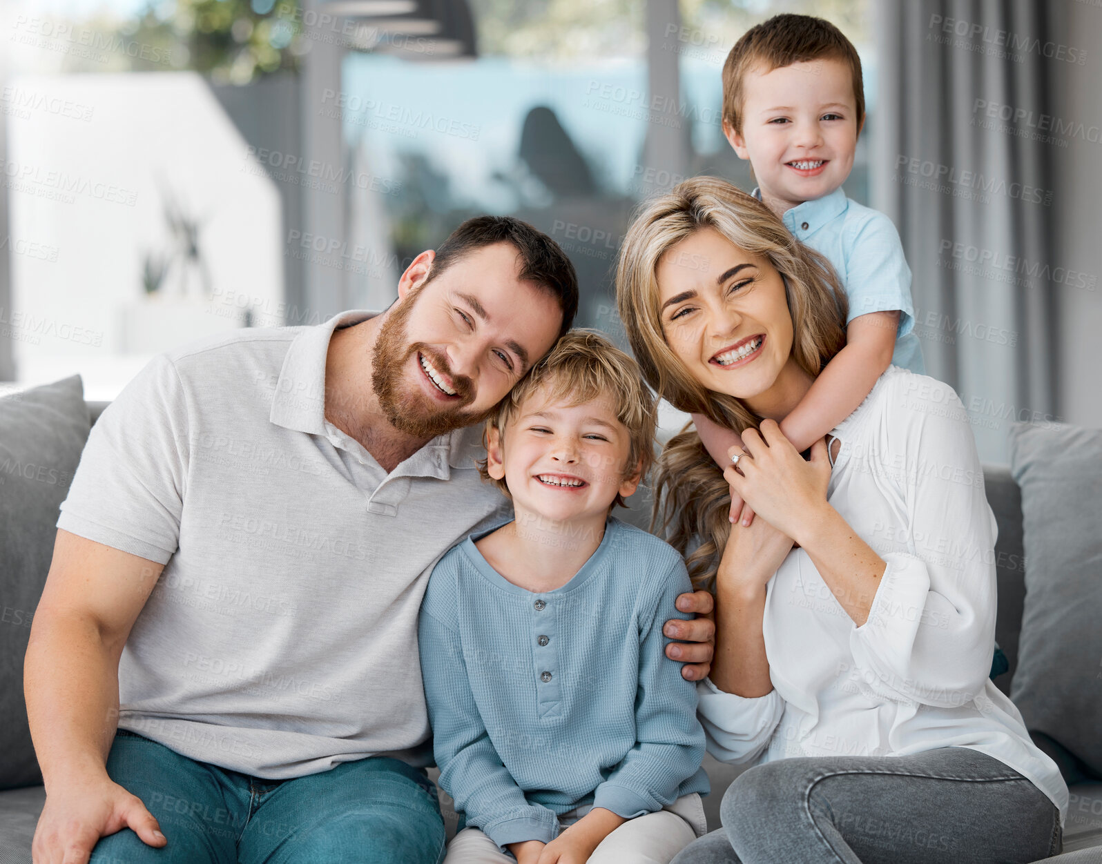 Buy stock photo Happy, family and portrait with hug in home with love, care and support together with a smile. Parents, children and youth on a living room couch with mother and dad bonding in lounge with embrace