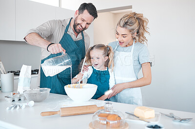 Buy stock photo Kitchen baking, family and teaching girl cooking, happy and help prepare milk, flour or food ingredients. Parents, love and fun or mother bonding with father, daughter development, support and care