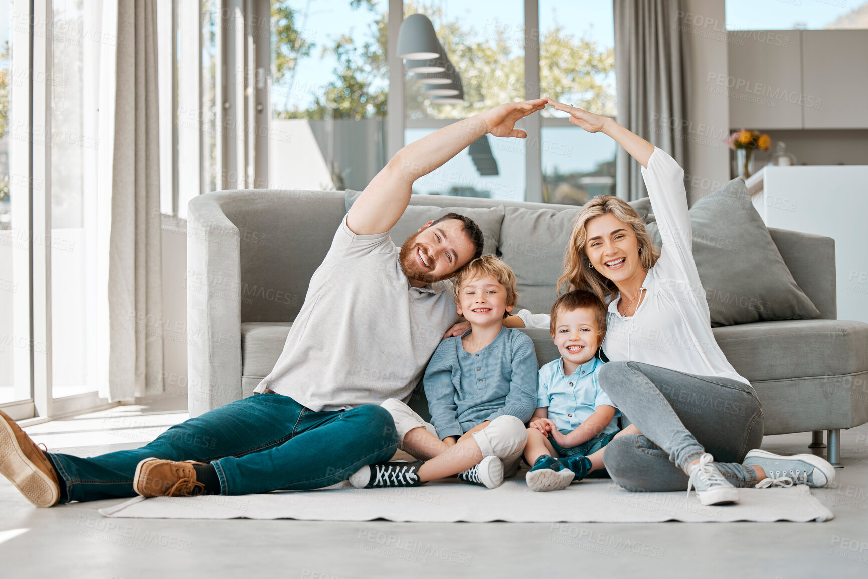Buy stock photo Insurance, portrait and family or happy in home for love, support and relax together on floor. Mom, dad and parents with kids or arms for new house for wellness or care and security in living room