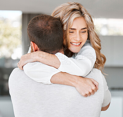 Buy stock photo Man, woman and hug in house for marriage or relationship, support and care for anniversary. Young happy couple, home and together with embrace for commitment to love, bonding with smile for date