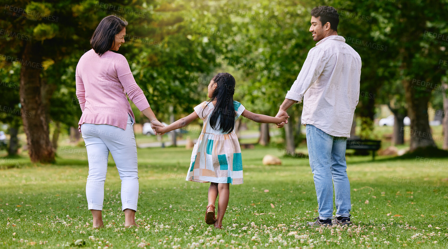 Buy stock photo Family, girl and holding hands in nature park, walking and garden with love for support or trust with people. Parents, child and outside for bonding with mother, summer and father together or back