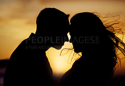 Buy stock photo Sunset, silhouette or couple touching forehead for love, trust or kiss on honeymoon. Man, woman or shadow in nature with hug, passion or support in relationship on trip for milestone or celebration