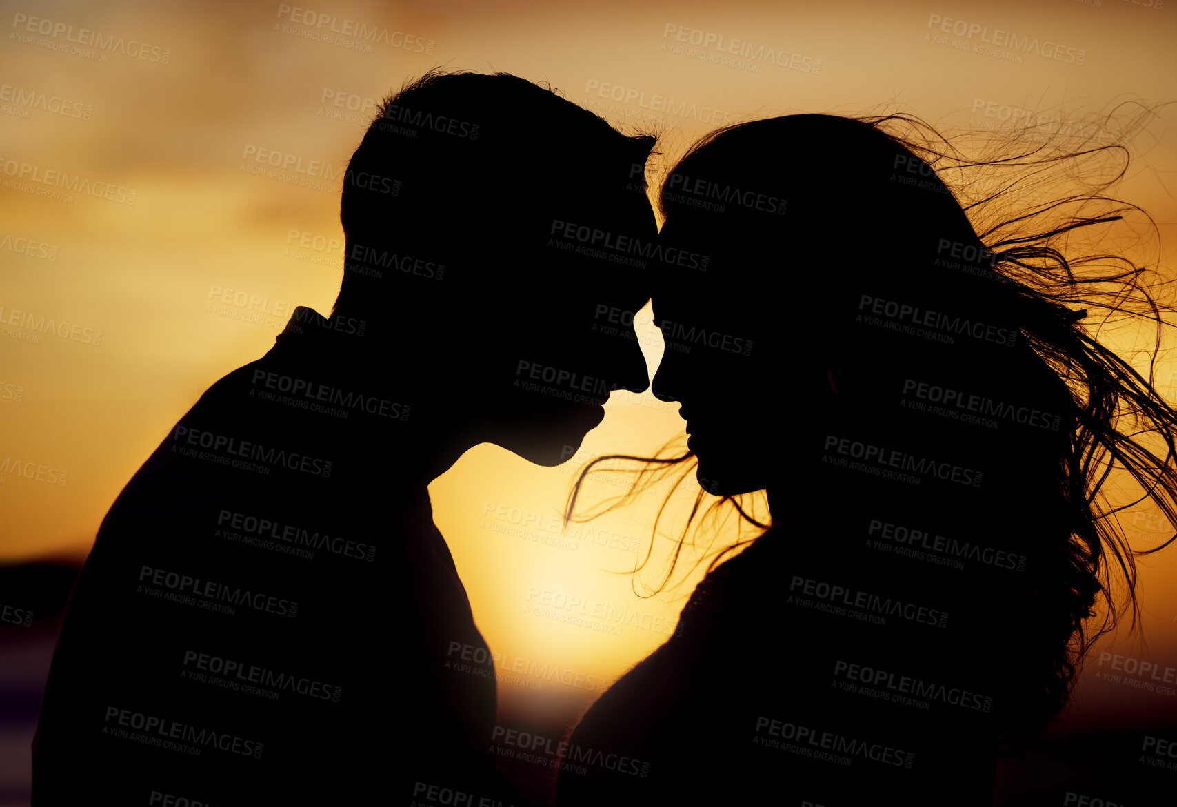 Buy stock photo Sunset, silhouette or couple touching forehead for love, trust or kiss on honeymoon. Man, woman or shadow in nature with hug, passion or support in relationship on trip for milestone or celebration