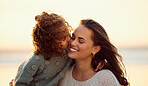 Loving mixed race mother at the beach with adorable little daughter. Mom and child enjoying beach day during summer vacation. Single mother enjoying quality time with her daughter against copyspace