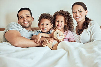 Buy stock photo Happy, family home and bed portrait with children and parents together with teddy bear in the morning. House, smile and bonding with love, youth care and support from mom and dad in bedroom with kids