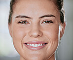 Closeup portrait of one smiling woman alone in gym. Headshot of beautiful happy caucasian trainer standing after workout in health club. Young coach in fitness centre for routine training and exercise