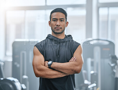 Buy stock photo Portrait, athlete and man with confidence in gym, serious and ready for workout, fitness and training.  Health club, guy and routine of exercise in morning, ambition and arms crossed for competition