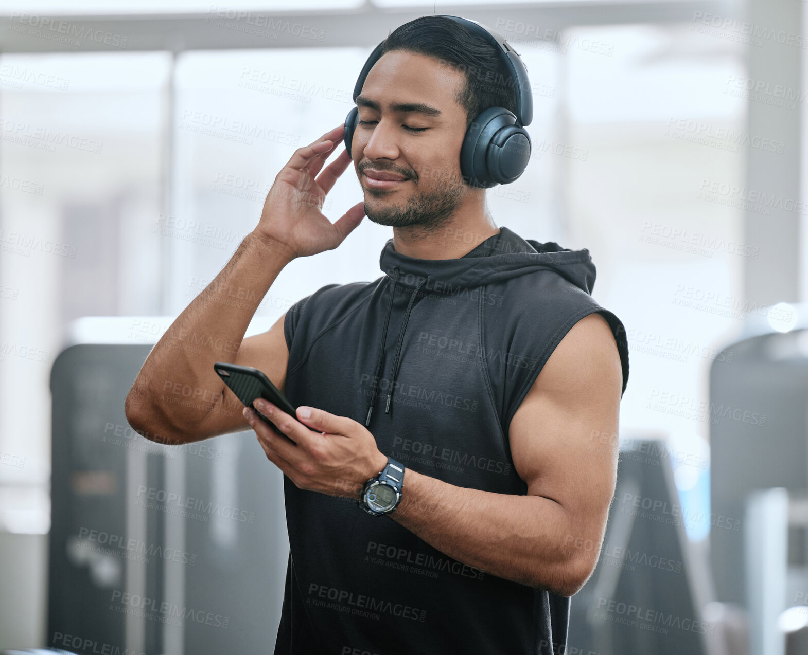 Buy stock photo Music, headphones and man with cellphone in gym, athlete and ready for workout, fitness and training. Health club, guy and routine of exercise in morning, ambition and preparing of competition