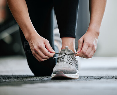 Buy stock photo Person, road and running with break for shoes or performance, exercise in city for wellness. Runner, workout and stop for rest with sneaker laces or pause, outdoor for healthy body on street