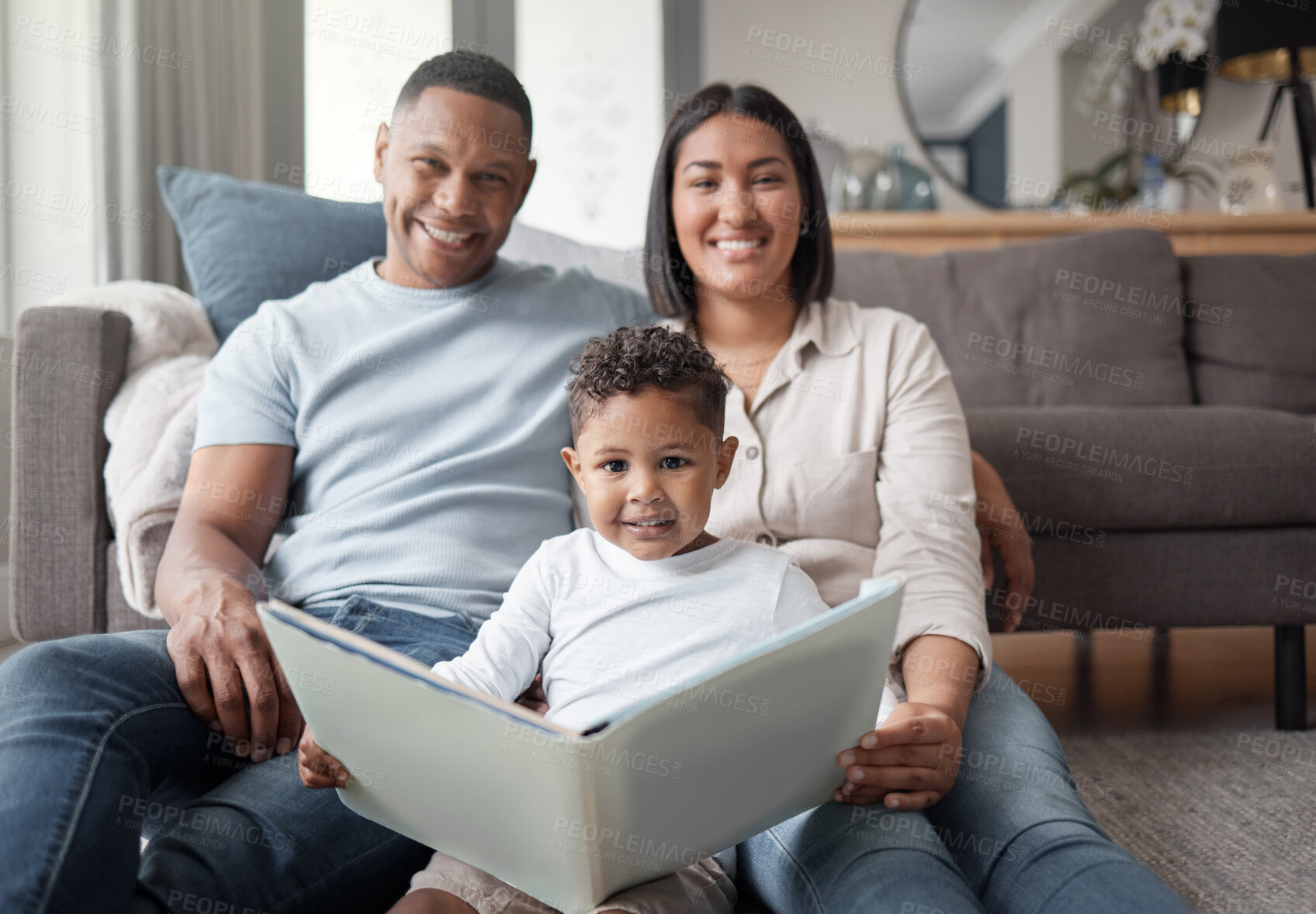 Buy stock photo Portrait, parents and child reading books on living room floor for educational fun, learning and development at home. Happy family, boy kid and relax for storytelling, knowledge and dinosaur animals