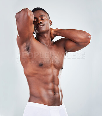 Buy stock photo Studio, bodybuilder or black man in underwear with healthy progress, confidence and fitness goals. Body, pride and male model with stomach muscle development, growth and self care on white background