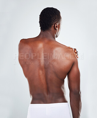 Buy stock photo Shoulder, injury and man with fitness in studio on mockup space with muscle pain from workout or exercise. African athlete, person or bicep with tension, inflammation or underwear on gray background 