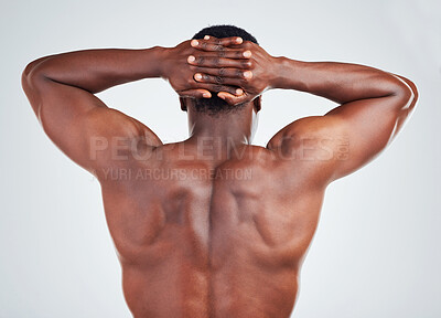 Buy stock photo Bodybuilder, man and back in studio with muscle for fitness progress, strong body and power. Athlete, black person and biceps strength with stretching, flexing arms and muscular on white background