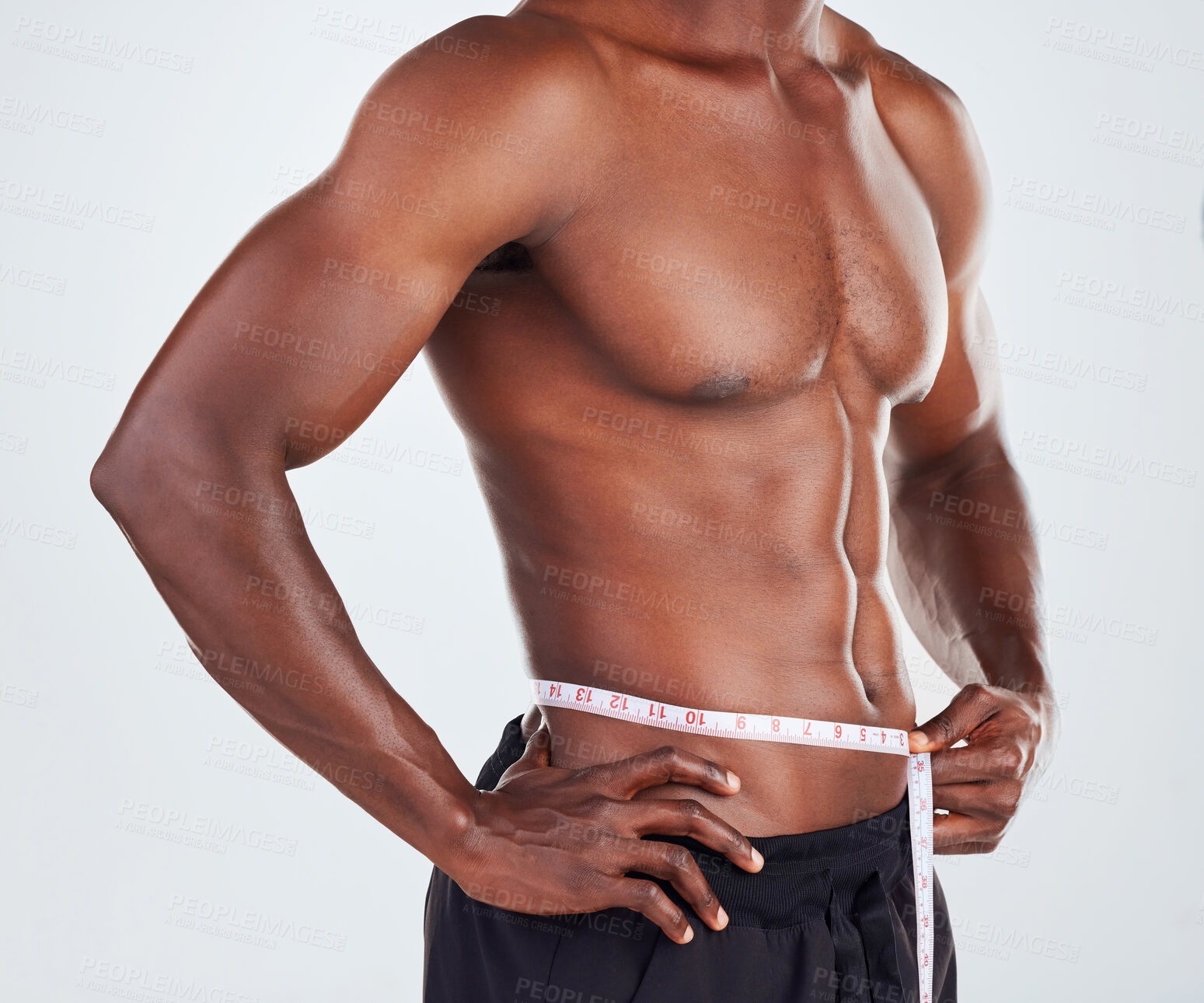 Buy stock photo Black man, fitness and waist with measuring tape for weightloss, diet or slimline on a gray studio background. Muscular African, male person or model with body measurement for wasitline, size or BMI