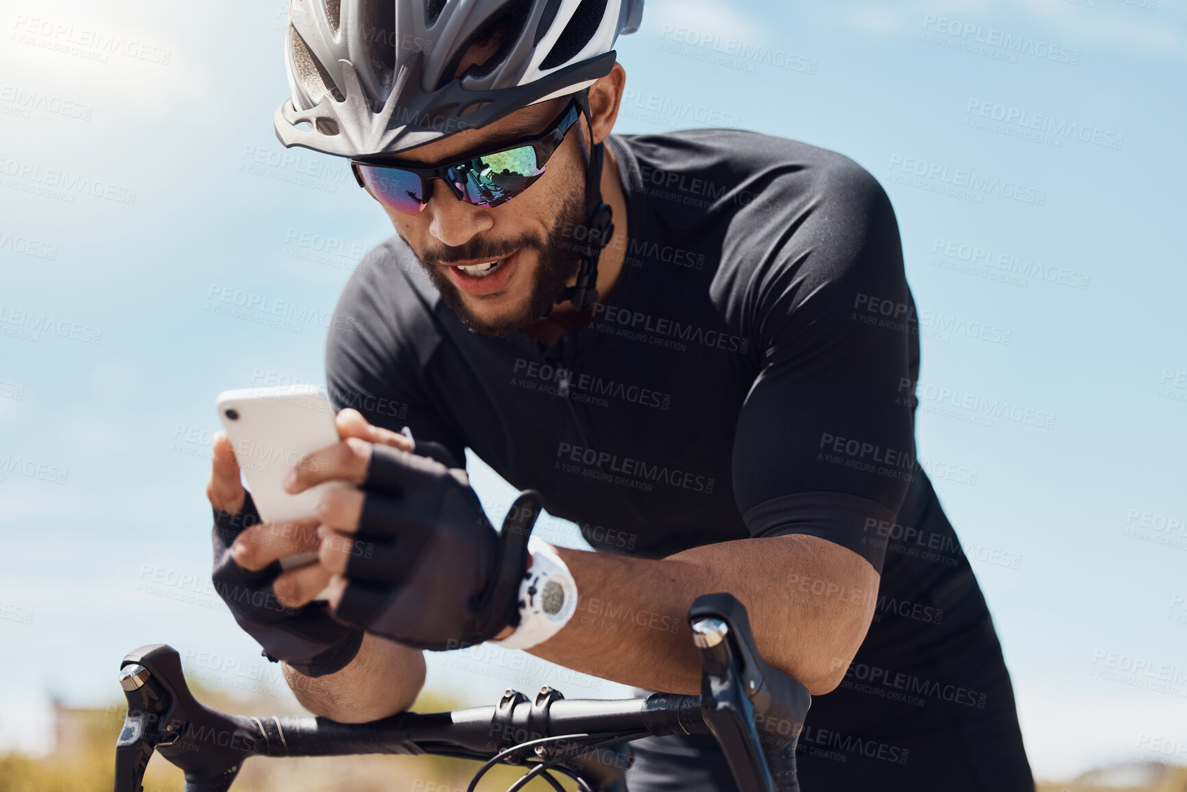 Buy stock photo Man, cycling and phone with workout app or check for race time, happiness for result with exercise. Male cyclist, bicycle or mobile with search for route or location, fitness or reading for heartrate