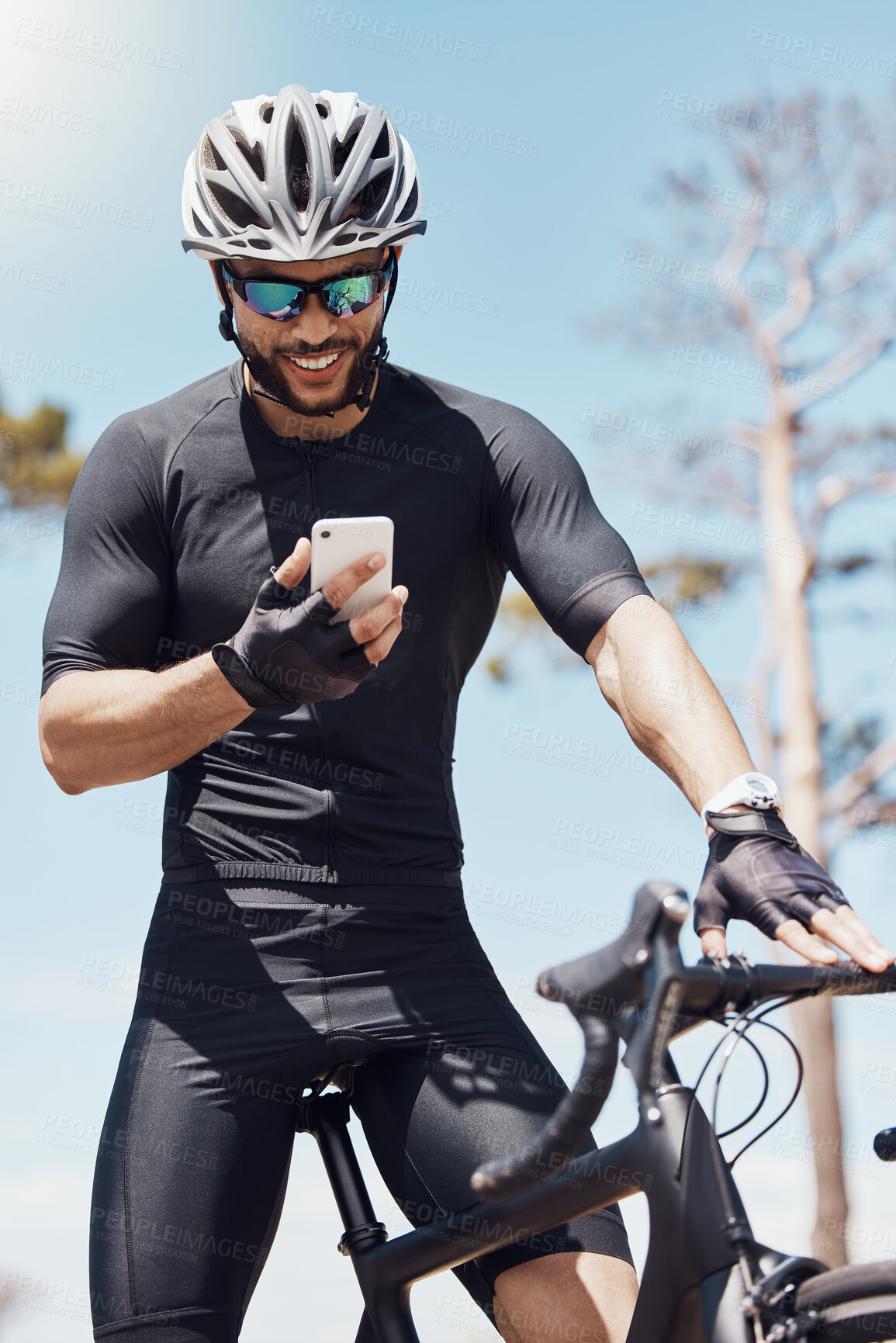 Buy stock photo Man, cycling and phone with fitness app or check for race time, happiness for result with workout. Male cyclist, bicycle or mobile with search for route or location, exercise or reading for heartrate