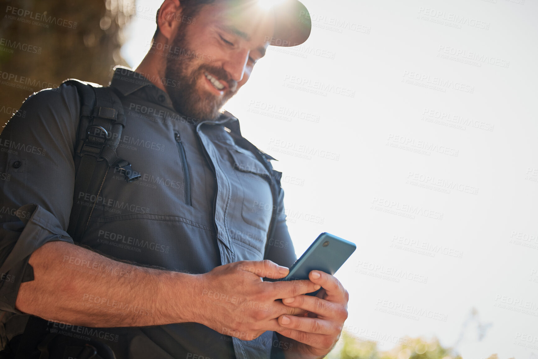 Buy stock photo Hiking, phone and smile with man in mountains for search map for navigation directions to location. App, backpacking and communication with hiker posting journey on social media for adventure