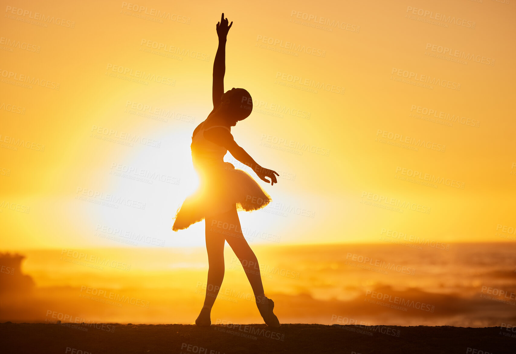 Buy stock photo Ballet, sunset and silhouette at beach for freedom, creative and dance with energy, water and balance. Ballerina, person and fitness outdoor by ocean for aesthetic, performance and exercise as artist