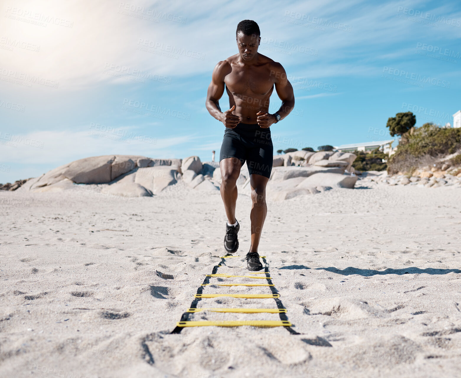 Buy stock photo Beach, black man and fitness for wellness, training and cardio with workout, flexibility and exercise. Agility ladder, African person and bodybuilder with routine, seaside and healthy with athlete