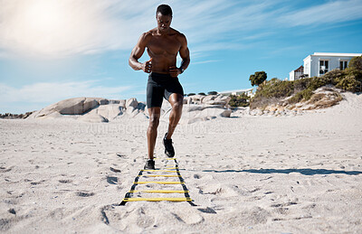 Buy stock photo Beach, man and fitness for wellness, agility ladder and cardio with workout, confidence and exercise. Outdoor, African person and bodybuilder with routine, seaside and healthy with training or energy