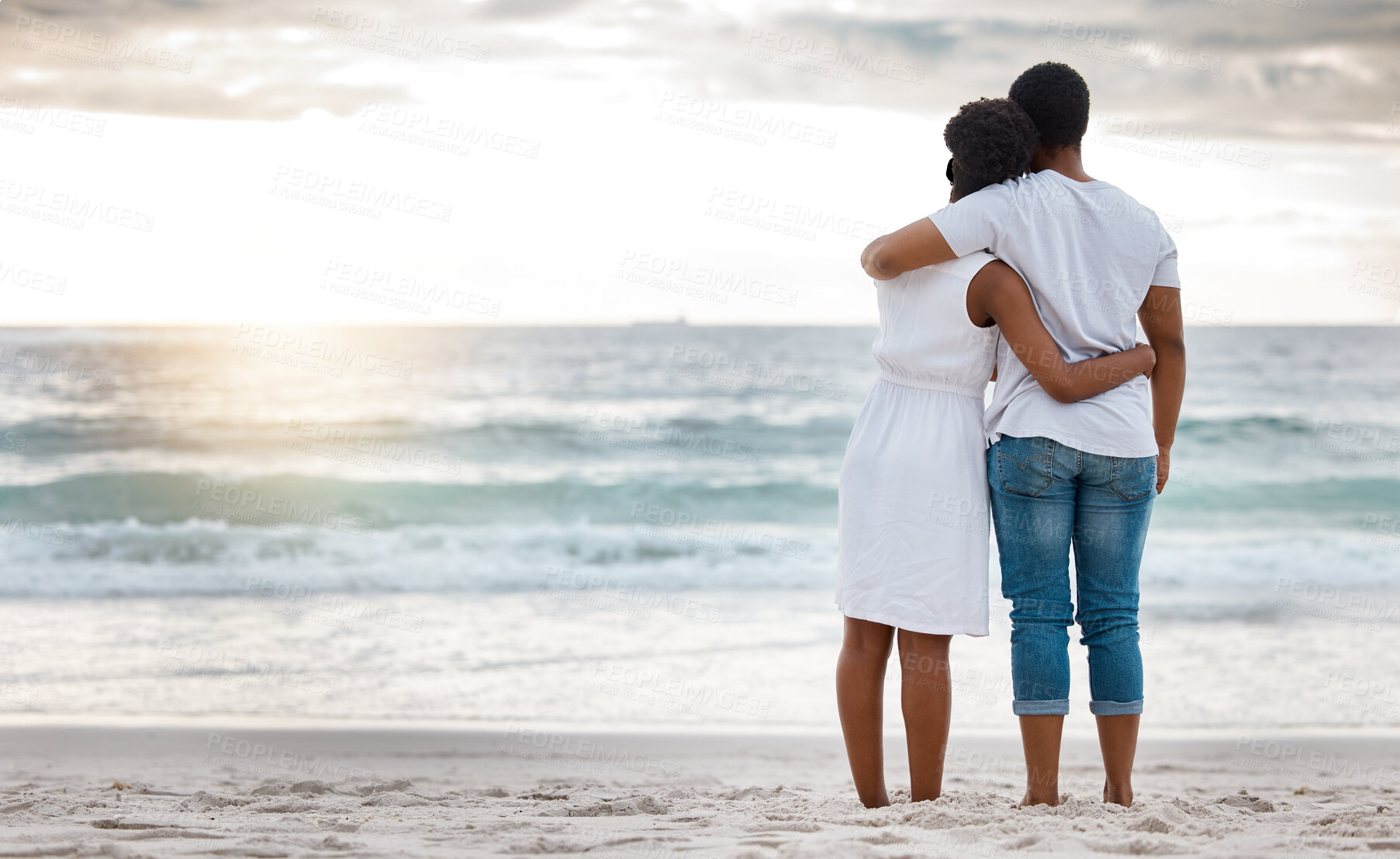 Buy stock photo Sunset, black couple and hug with beach view, having fun or celebrating together for anniversary. Vacation, honeymoon and people with romance, travel and marriage on summer holiday and Miami ocean