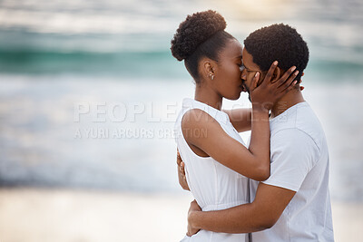 Buy stock photo Sunset, black couple and kiss with love, beach and celebrating together for anniversary. Vacation, honeymoon and people relax with romance, travel and marriage on summer holiday and Miami ocean