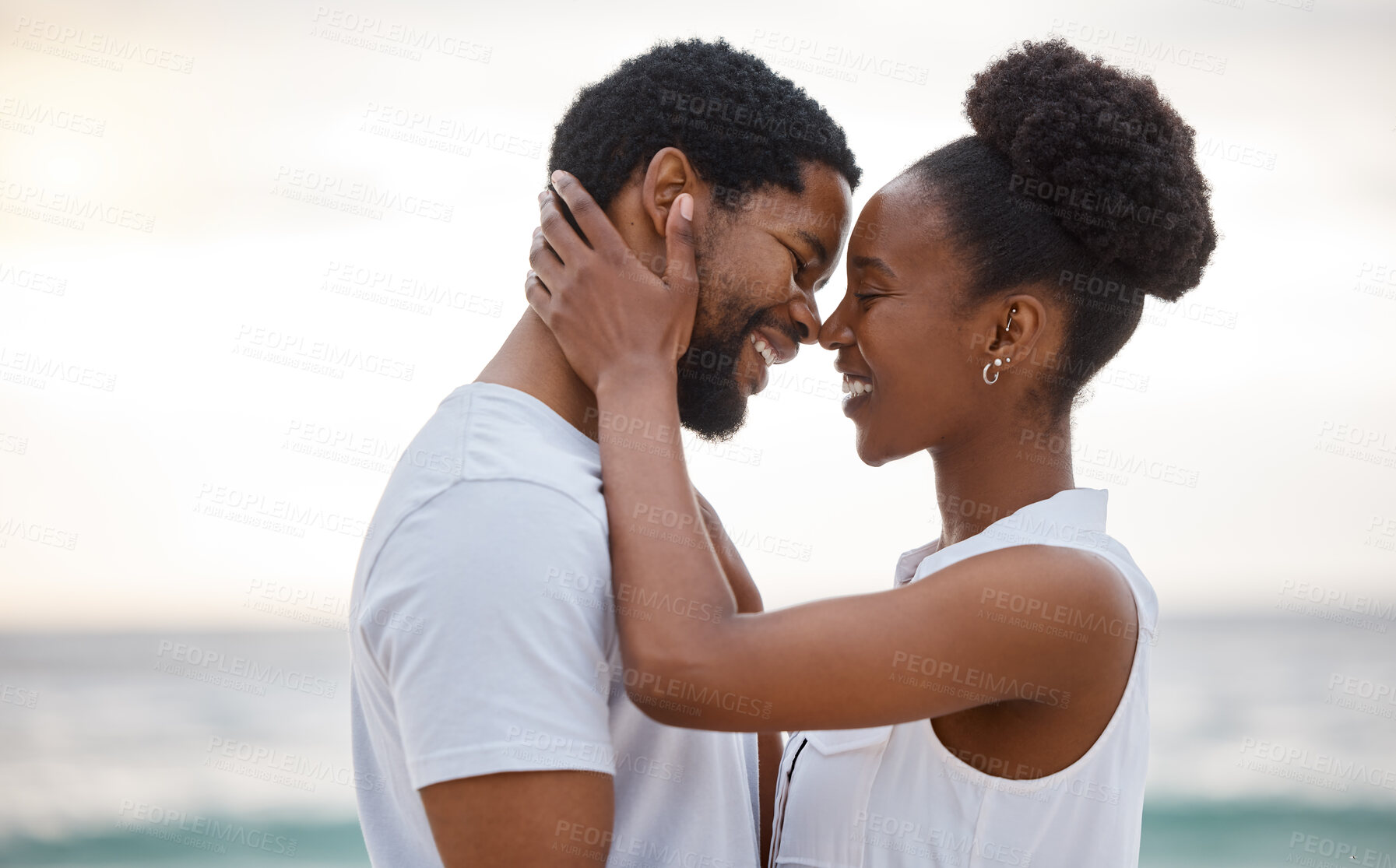 Buy stock photo Sunset, black couple and smile with romance, beach and celebrating together for anniversary. Vacation, honeymoon and people relax with love, travel and marriage on summer holiday and Miami ocean