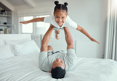 Buy stock photo Dad, girl and happy with flying in bed at home for fun to relax, bonding and care in Brazil. People, parent and kid in bedroom with playing for support, child development and childhood memories