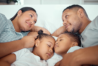 Buy stock photo Parents, children and sleeping on bed in home for relax, fatigue and break together on weekend. Family, kids and mother with father, girls and smile in bedroom for rest, tired and quiet in morning